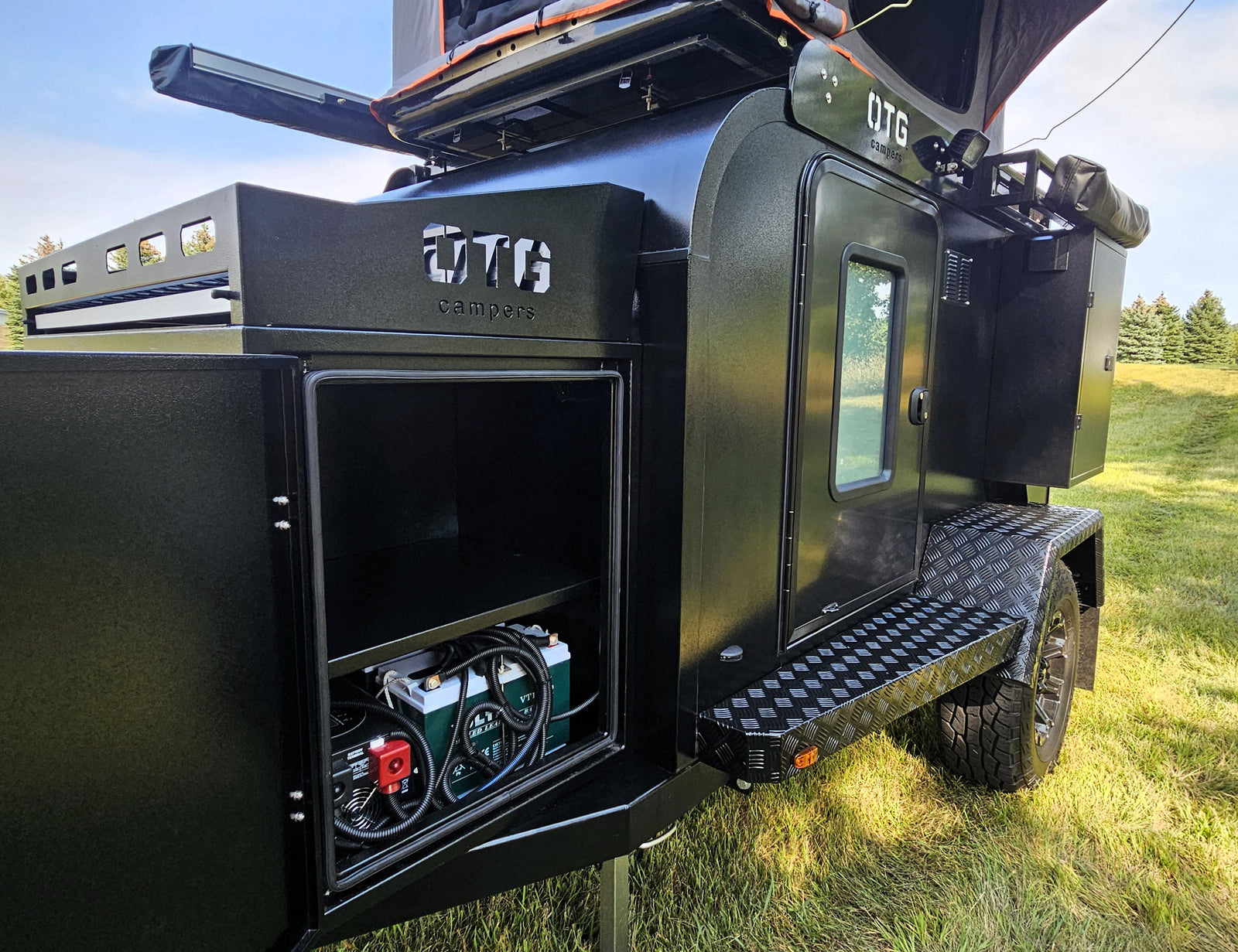 an ideal RV rental for off-grid adventures.|Black OTG camper trailer for rv rental