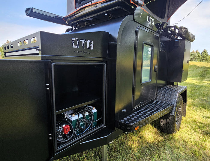an ideal RV rental for off-grid adventures.|Black OTG camper trailer for rv rental