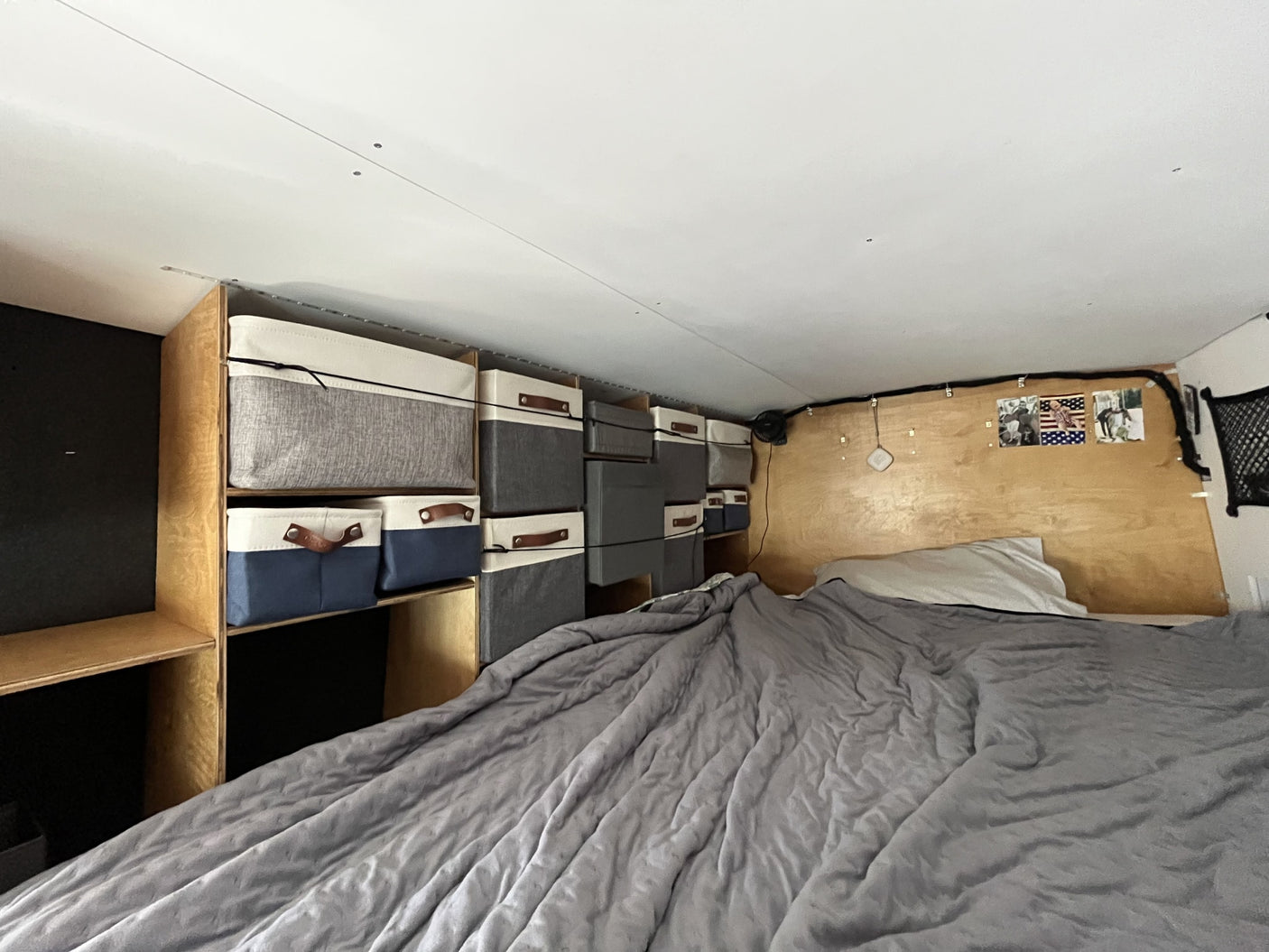 and a versatile fold-down table over seating.|RV rental: View inside a modern camper van with a kitchen