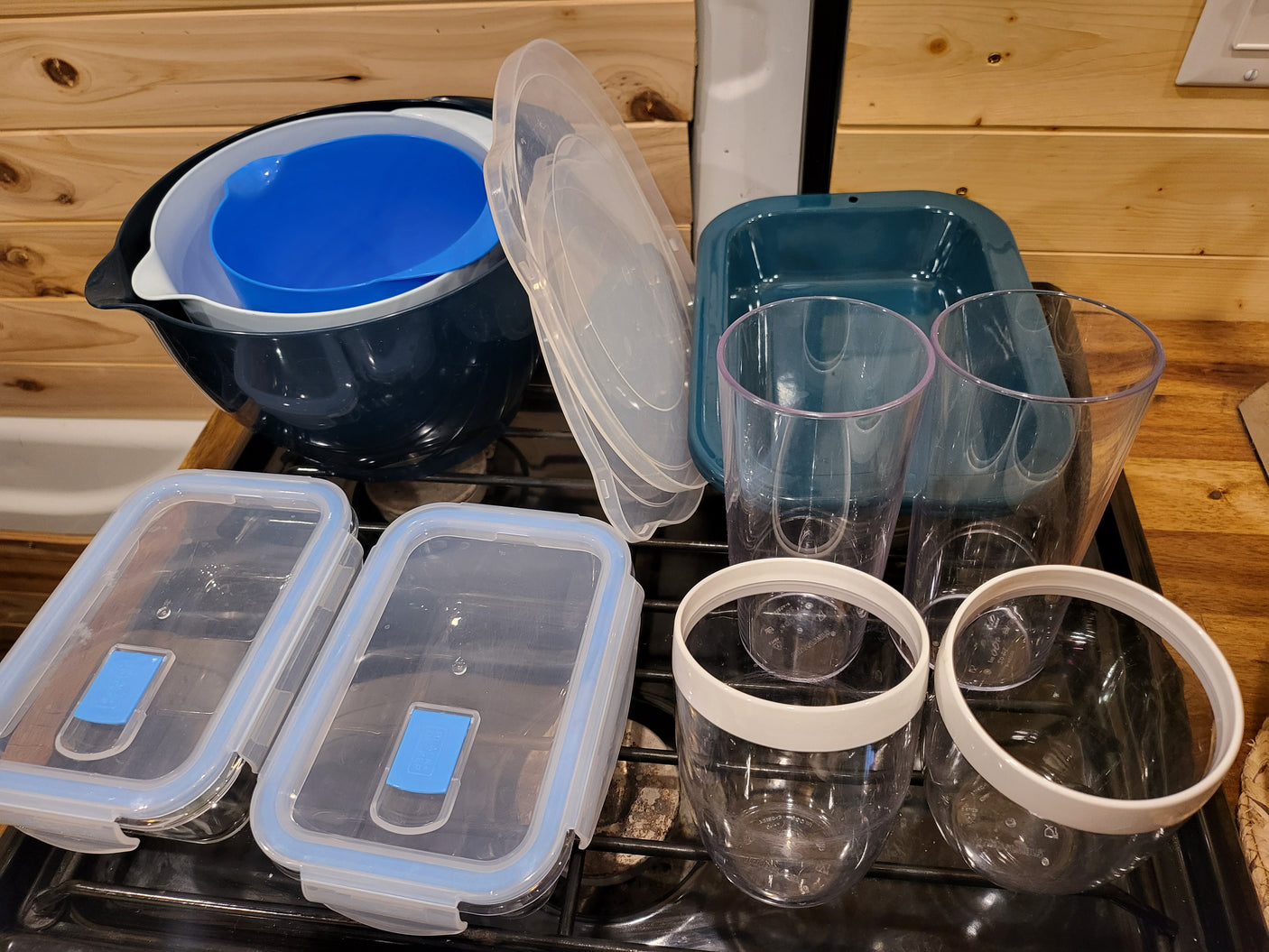 Kitchen items ready for your RV rental adventure: nesting bowls, bakeware, cups, and sealed food storage containers.