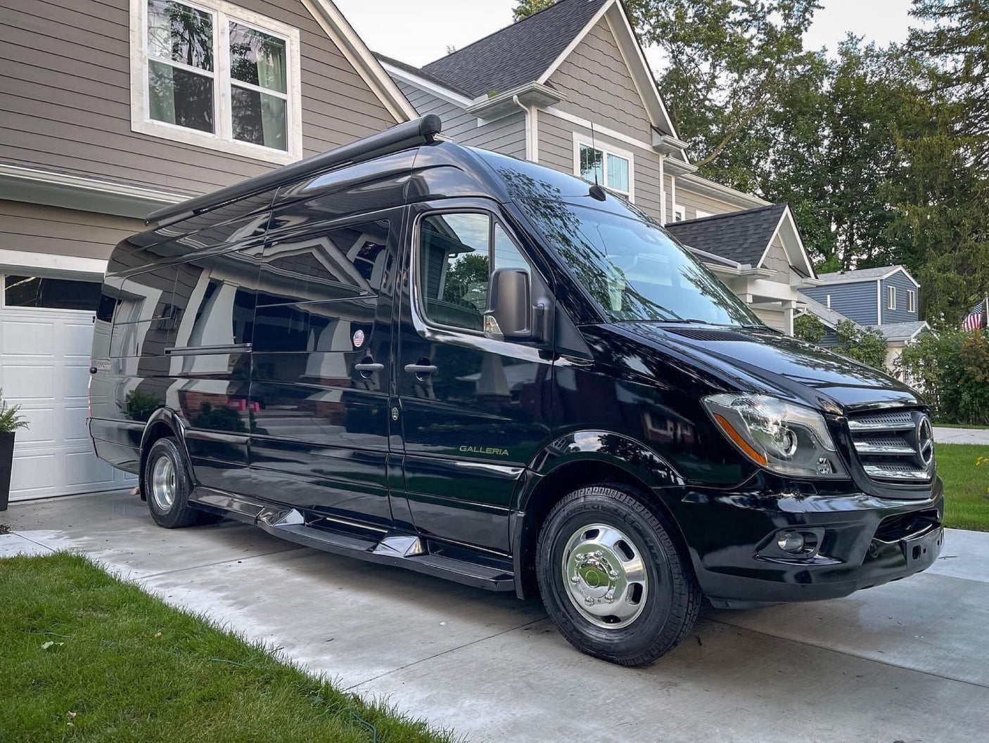 Sleek black Mercedes Sprinter Class B RV rental
