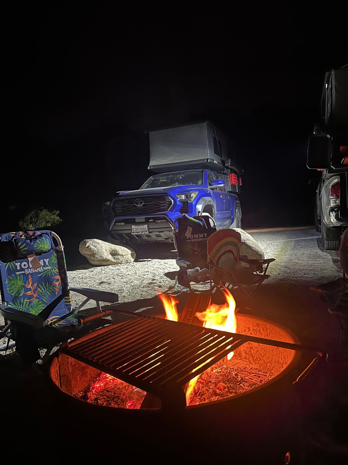ready for adventure. Explore our RV rental options!|Blue Toyota Tacoma truck with rooftop tent & side awning — photo 5