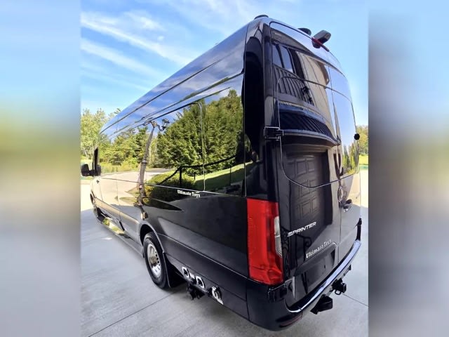 and sleek wood-look flooring.|Black Mercedes-Benz Sprinter luxury RV rental van with tinted windows and awning. Ideal for your next road trip adventure.|Experience premium travel in this sleek black RV rental van