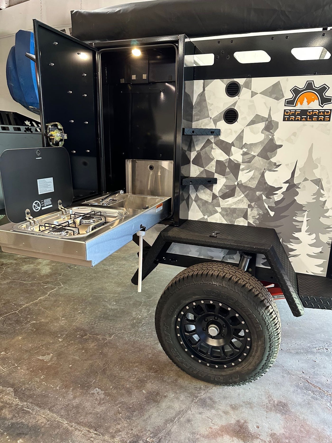 Rugged off-road trailer for your rv rental. Features a pull-out outdoor kitchen with stove and sink, plus heavy-duty tires. — photo 7