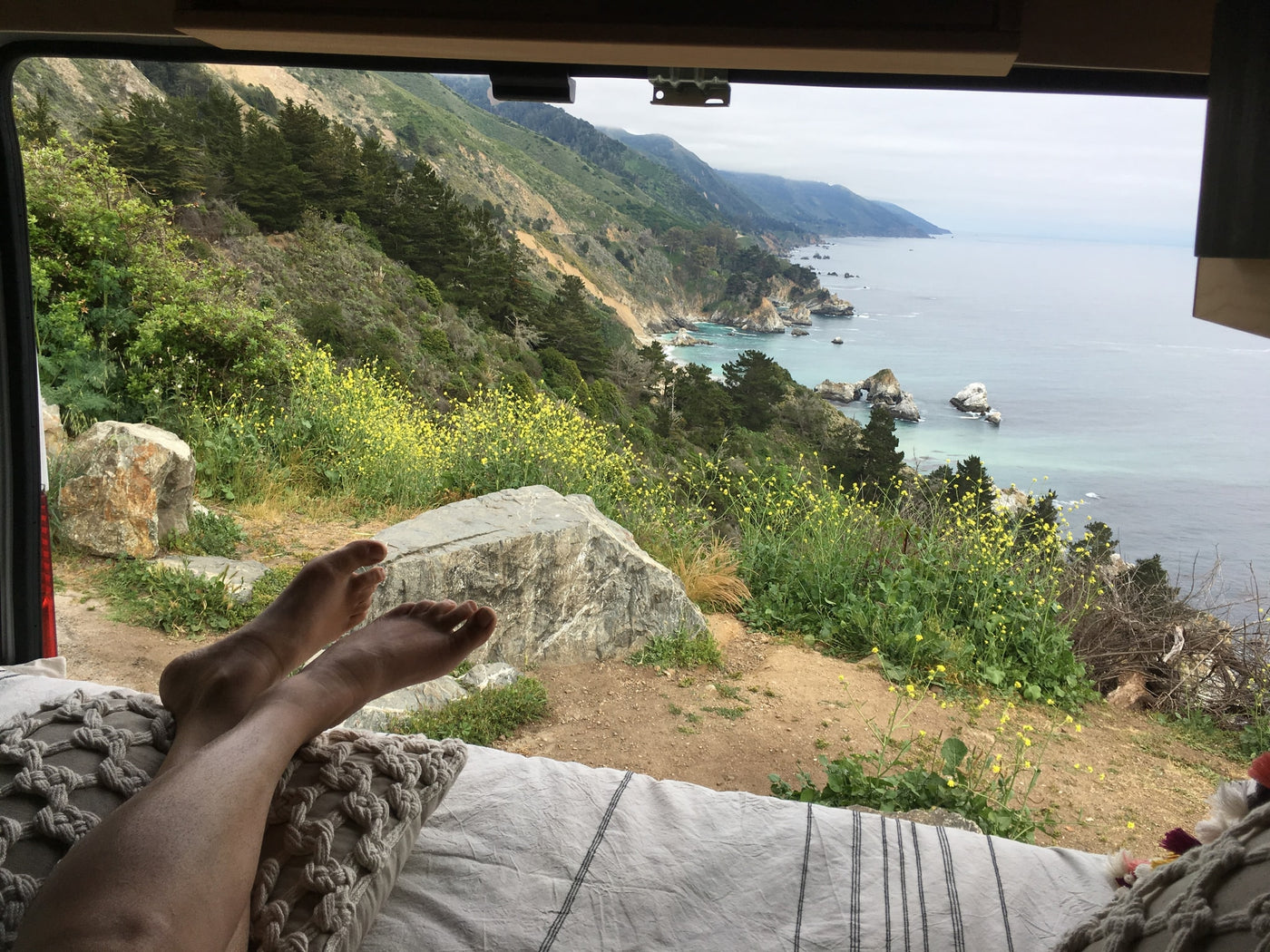 overlooking scenic mountains and the ocean.|Coastal RV rental dream! White camper van — photo 8
