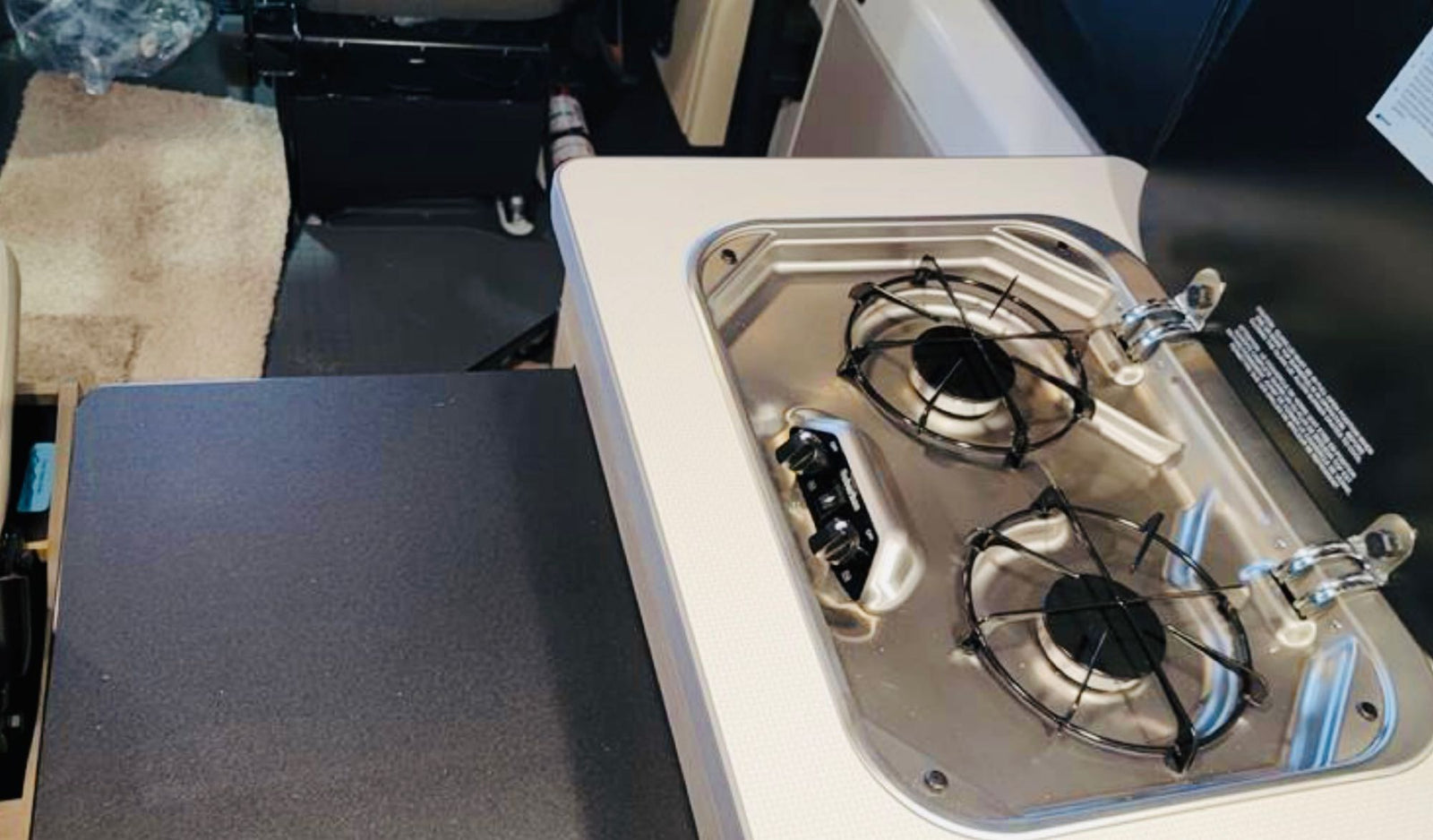 ideal for cooking on the go.|Rear of a white camper van RV rental