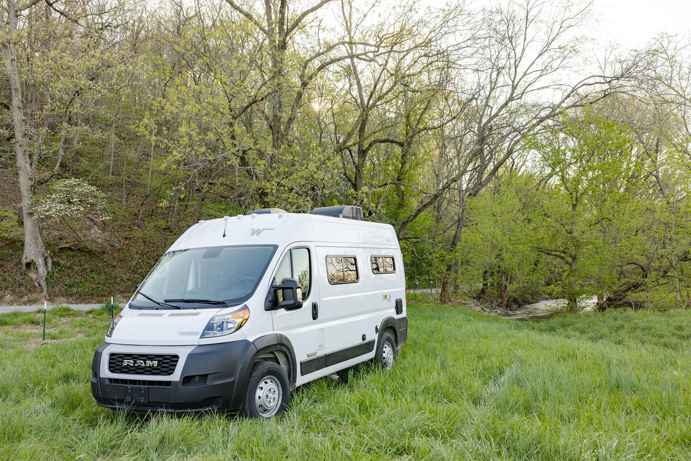 ideal for road trip adventures.|Cozy RV rental interior featuring a comfortable bed
