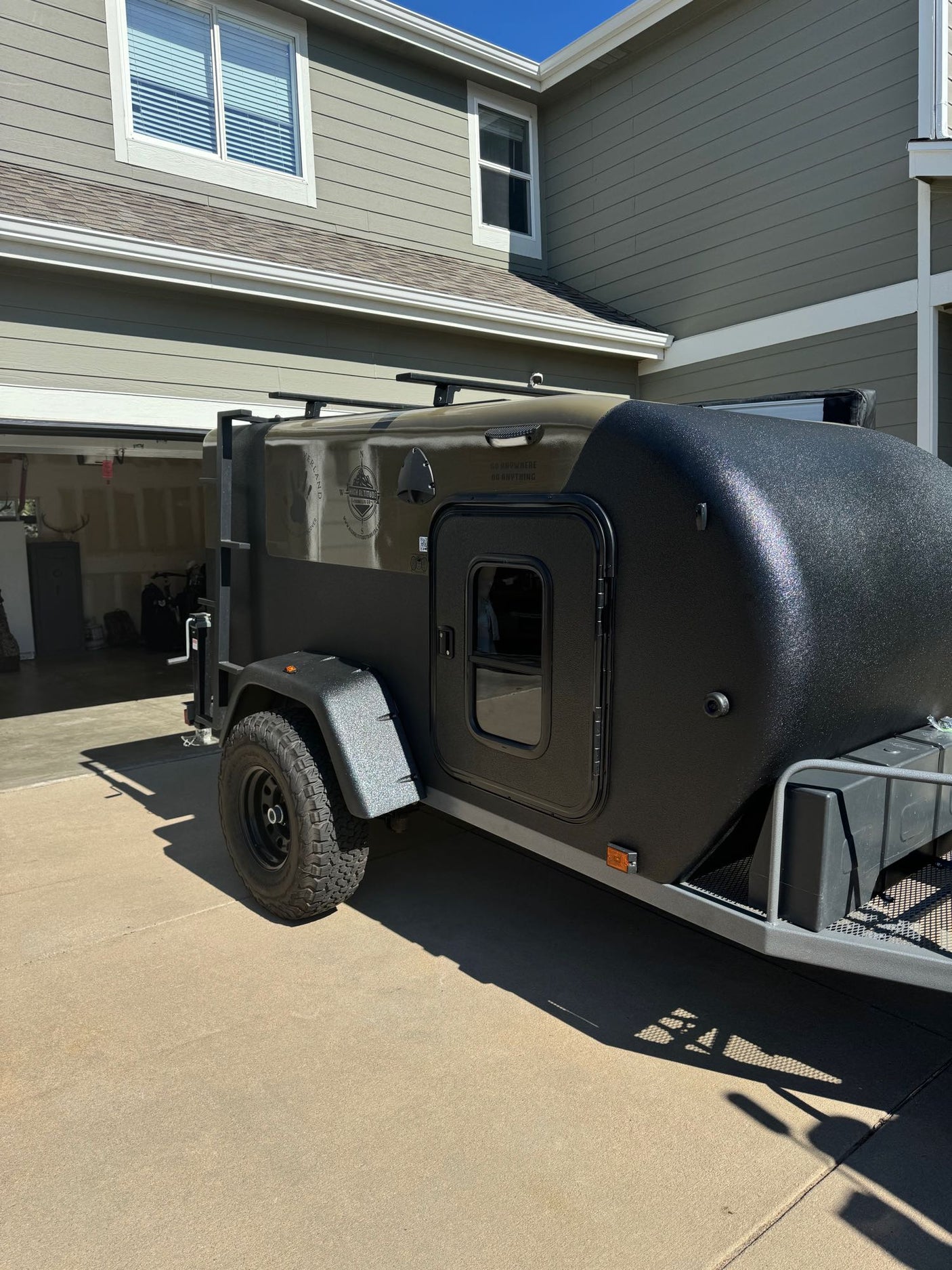 large tires & propane tank.|Dark