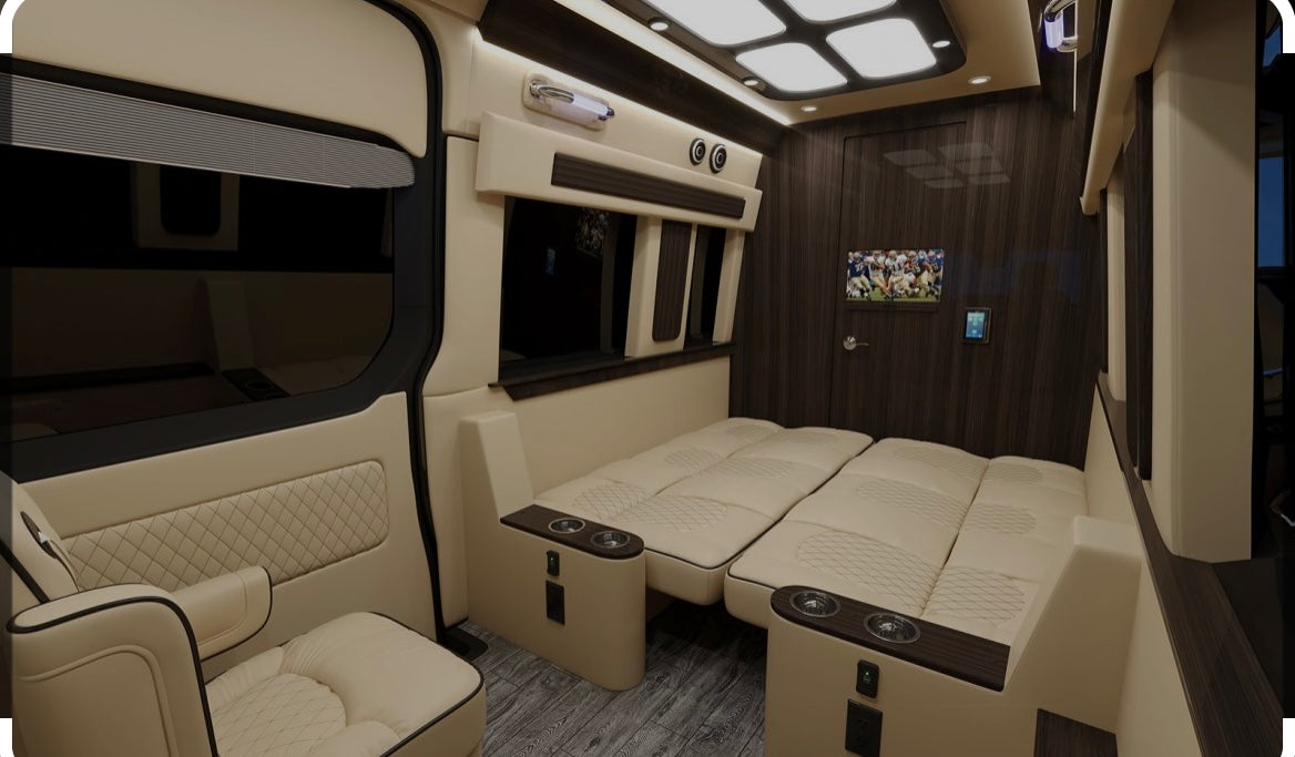Explore this luxurious RV rental interior: spacious seating that converts to beds, large windows, TV, and sleek wood accents.