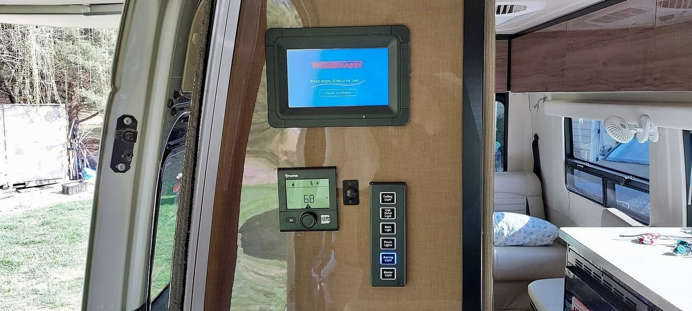 RV rental interior: Winnebago smart control panel, Truma thermostat, and light switches offer modern mobile living.