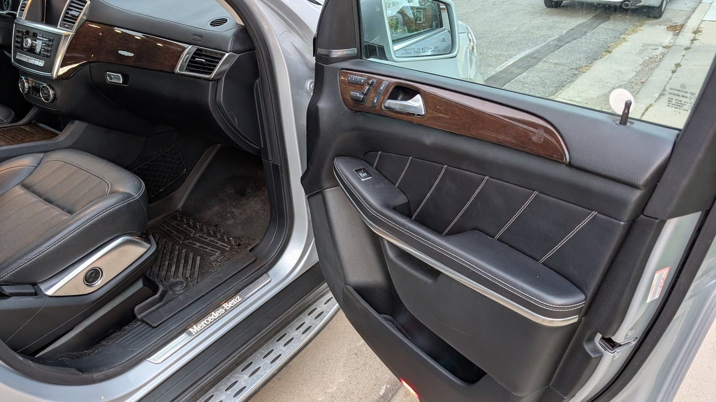 Explore the spacious interior of this Mercedes-Benz, from dashboard to leather seat. An excellent choice, even if you considered an RV rental.