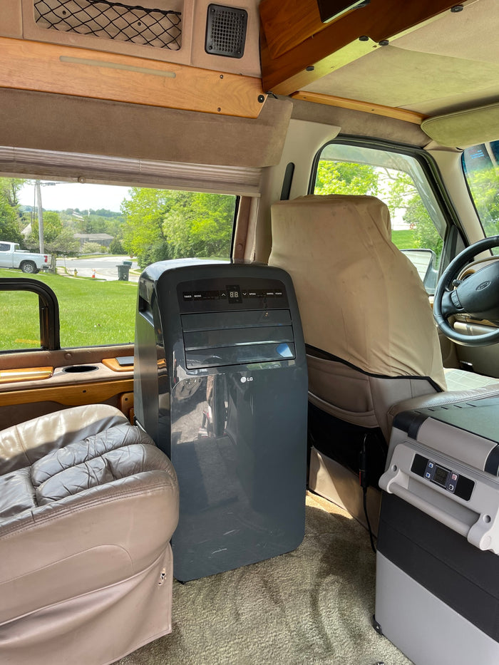 typical RV storage solution.|RV rental interior with USB charging ports
