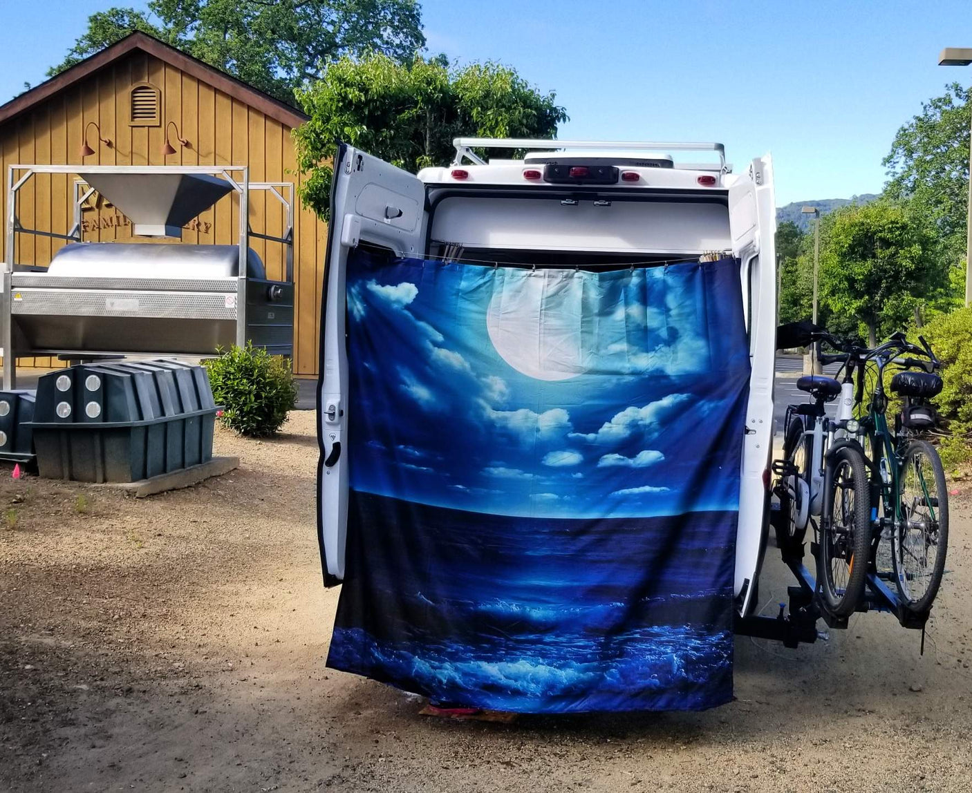 and storage.|Inside a modern RV rental: view from the kitchen with wood counters