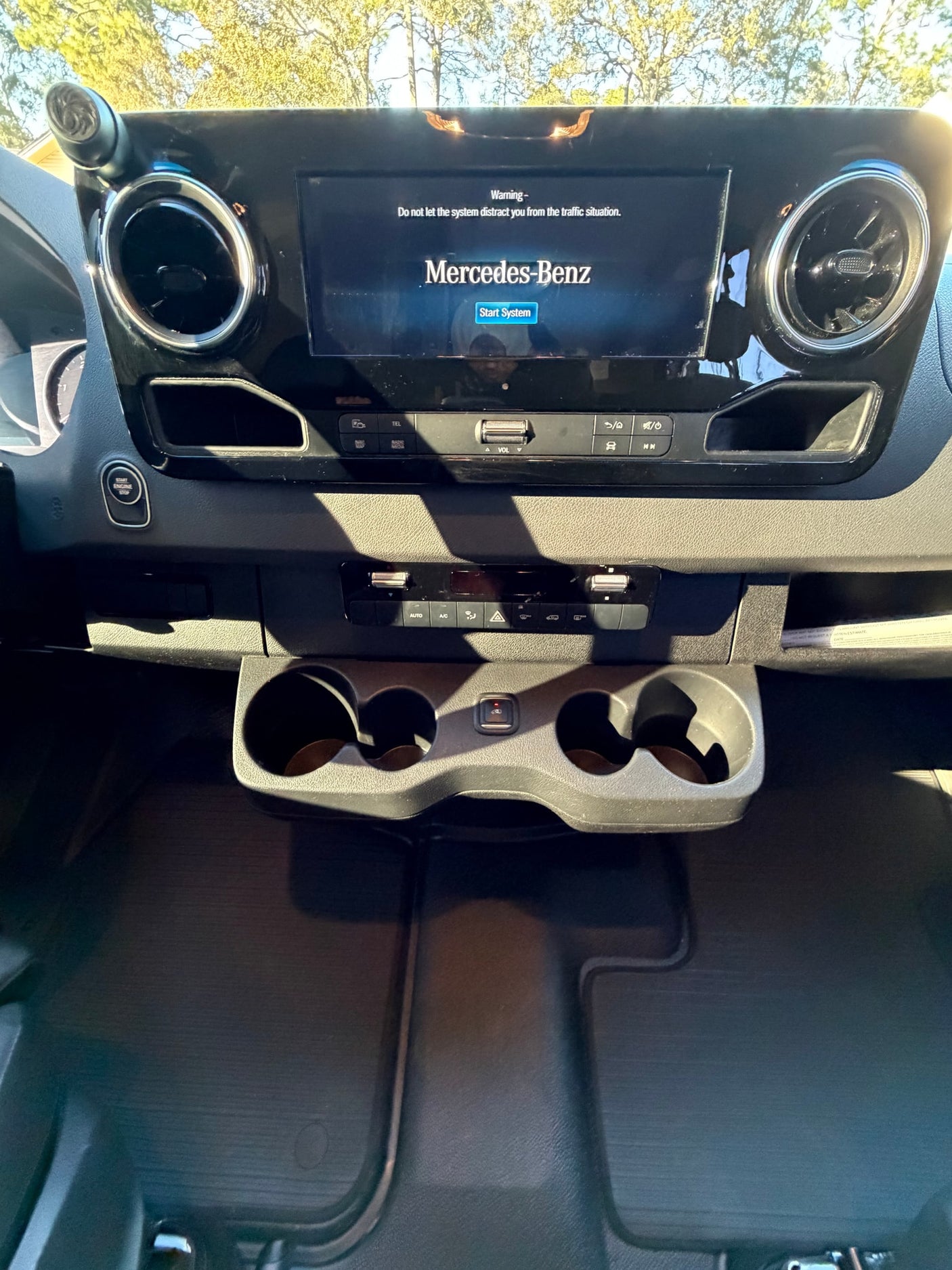 and rear storage for adventure.|Front view of a silver Mercedes-Benz Sprinter van