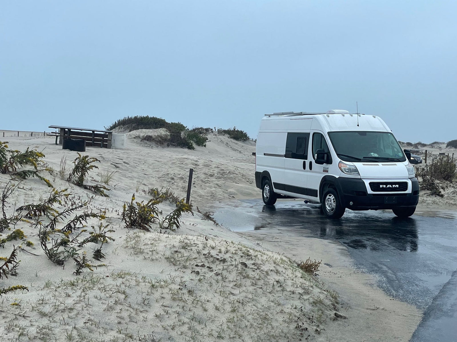 and side window street view.|Modern RV rental interior with shiplap walls
