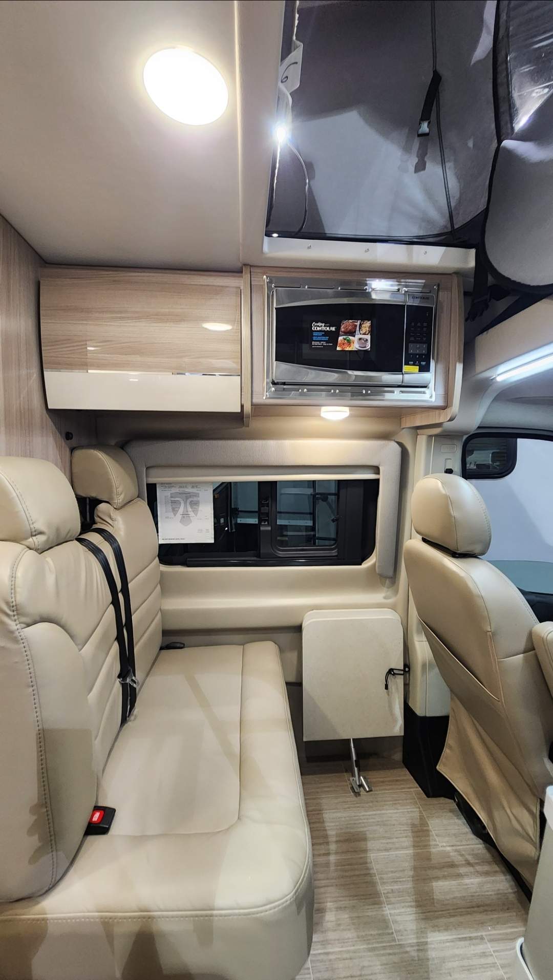 parked by water.|Bright rv rental interior: full kitchen (stove