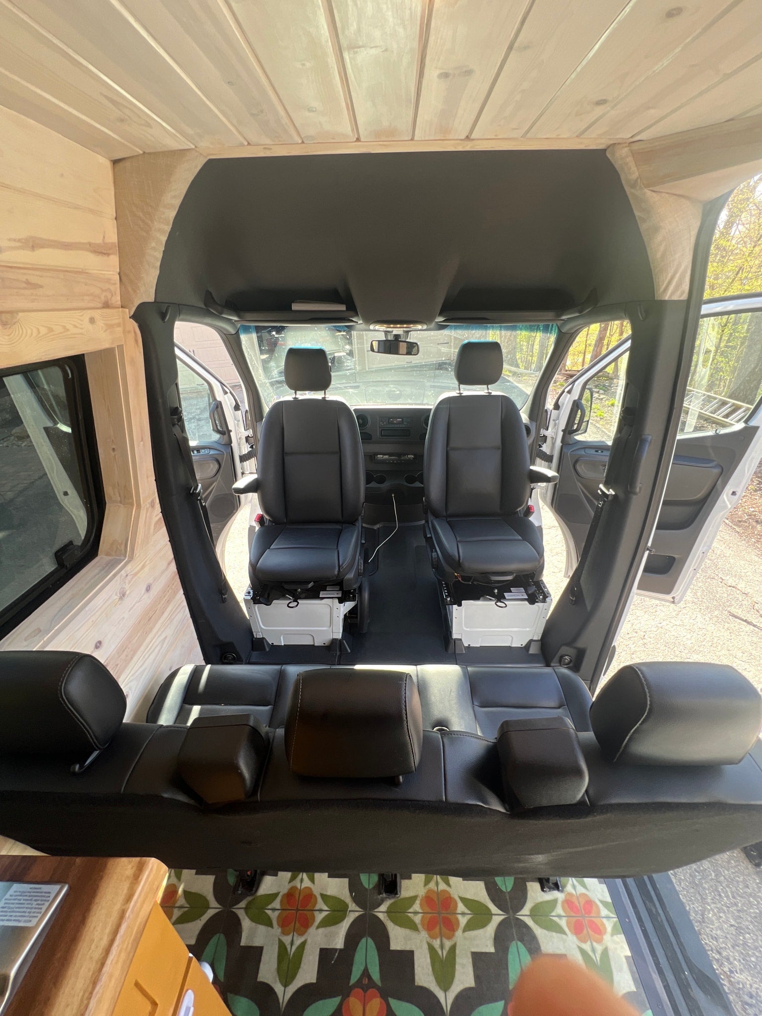and a cozy dining bench.|View inside an rv rental: Wood-paneled walls & ceiling