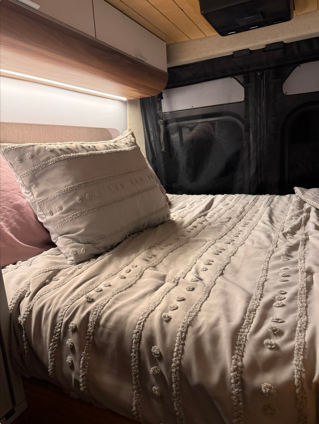 and a scenic river view outside.|Step inside this modern RV rental! Features a sleek kitchen with sink & induction cooktop