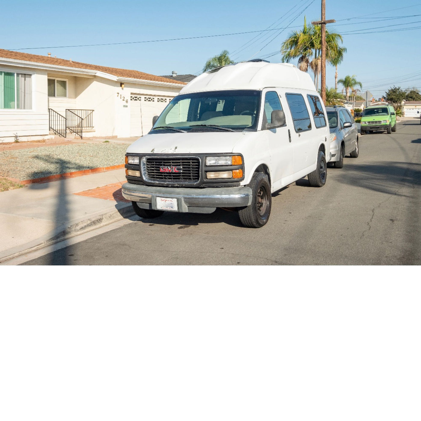 and a mounted TV.|Inside this rv rental: cozy living space with grey seating — photo 4