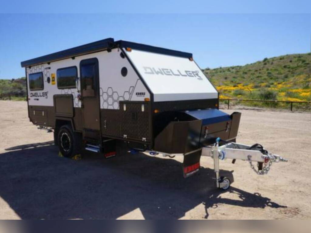 and a bed. Wood-look floor.|Spacious RV rental interior featuring a comfortable dinette with bench seating — photo 15