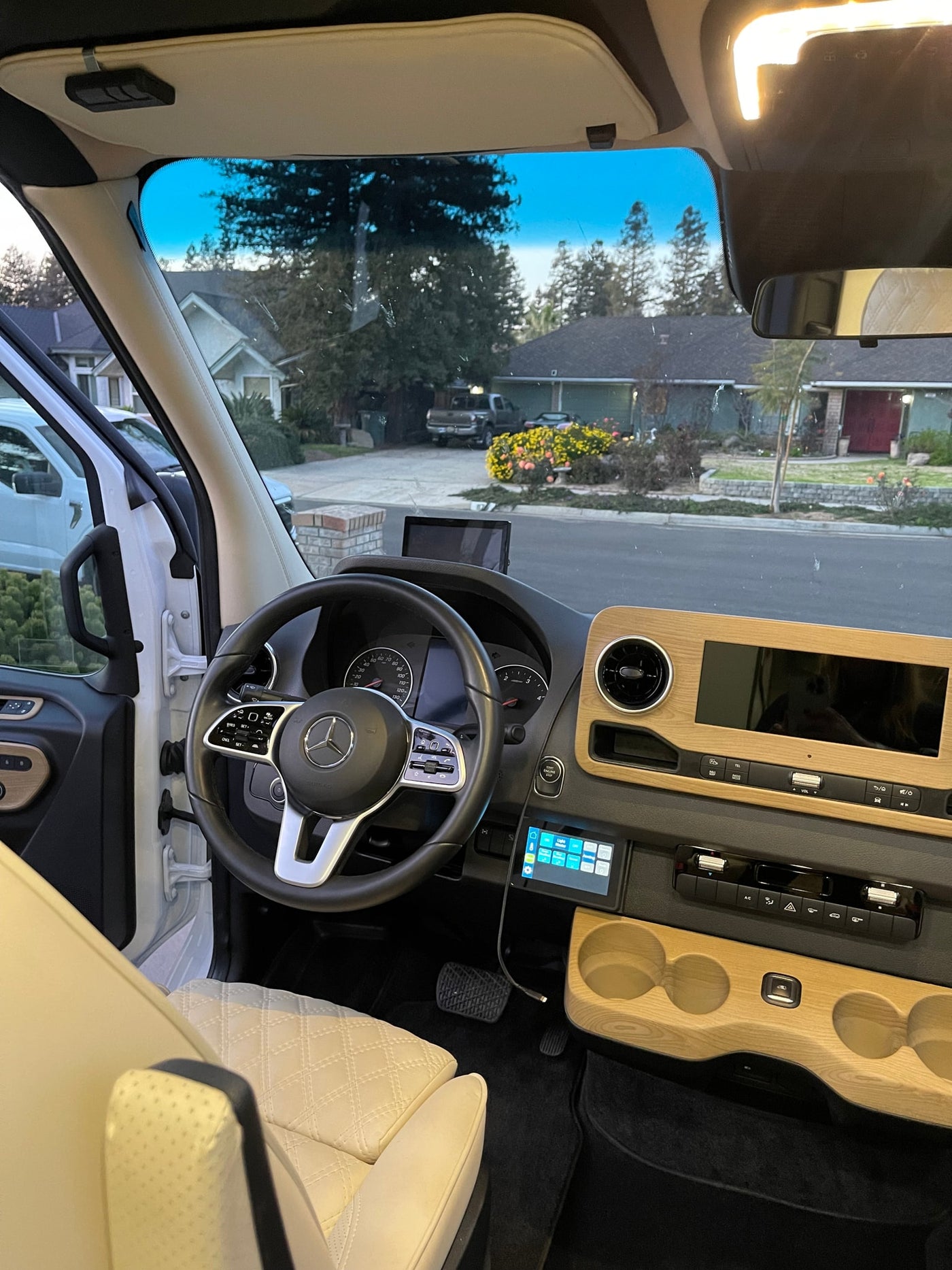 Experience a premium RV rental! Bright, modern van interior with sleek dashboard and driver's seat, ready for adventure. — photo 8