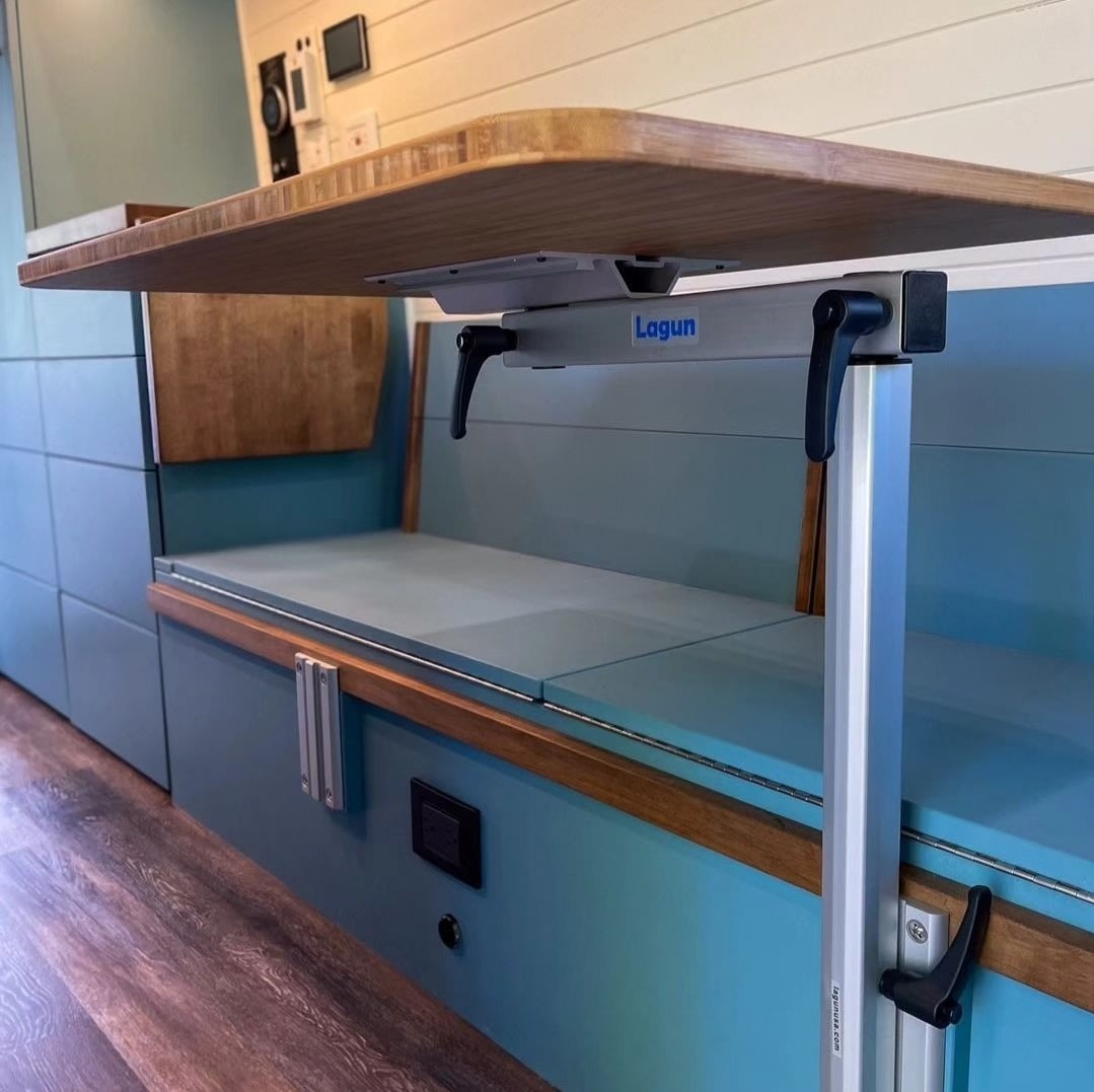 and a steel shower pan.|RV rental bathroom with white tiles
