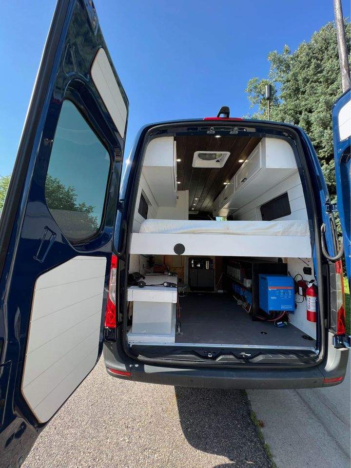 dark blue Mercedes-Benz Sprinter camper van is available for rv rental — photo 7