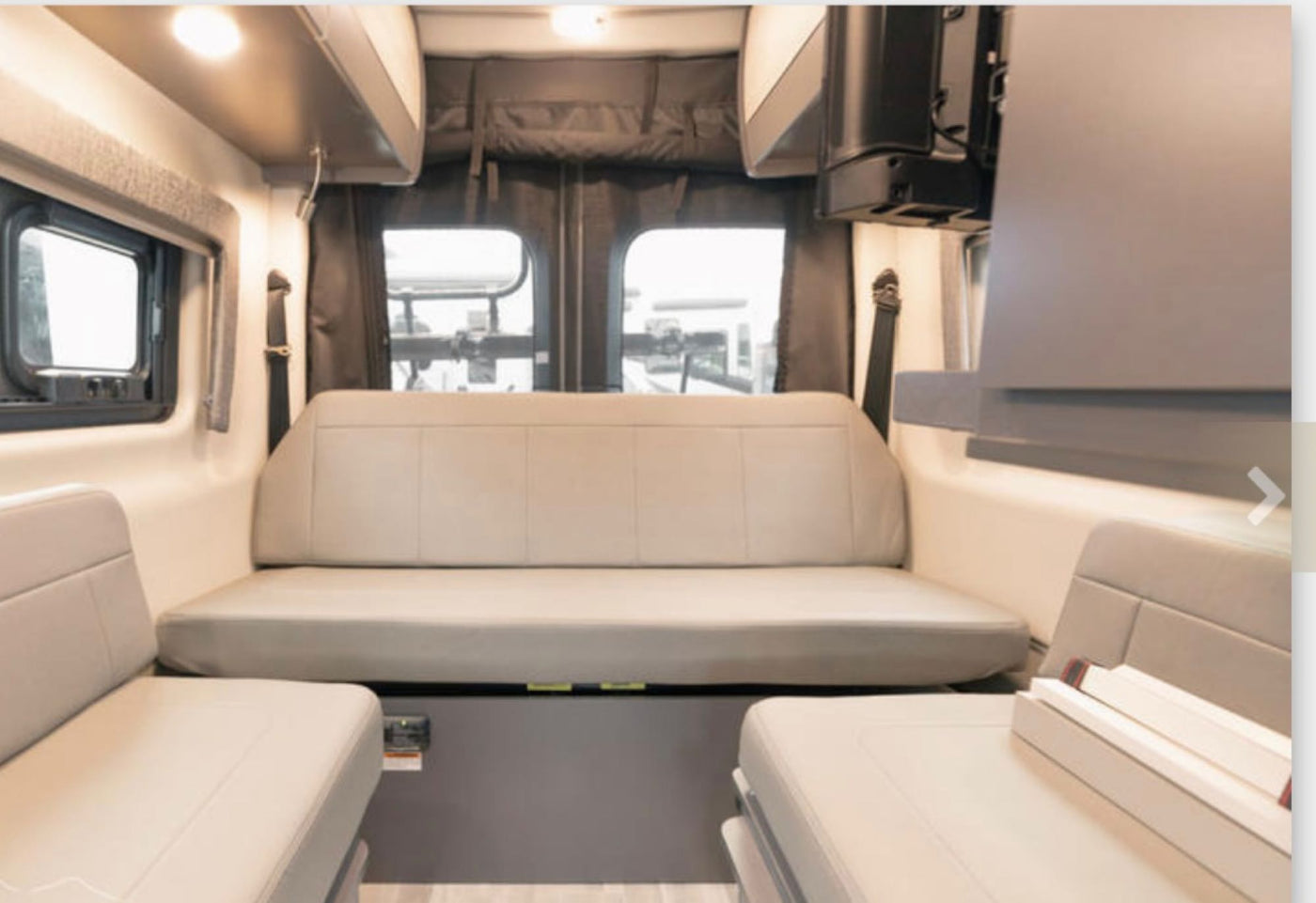 and swivel chairs for travel comfort.|White Thor Tranquility 4x4 Mercedes-Benz Sprinter rv rental showing its rear — photo 7