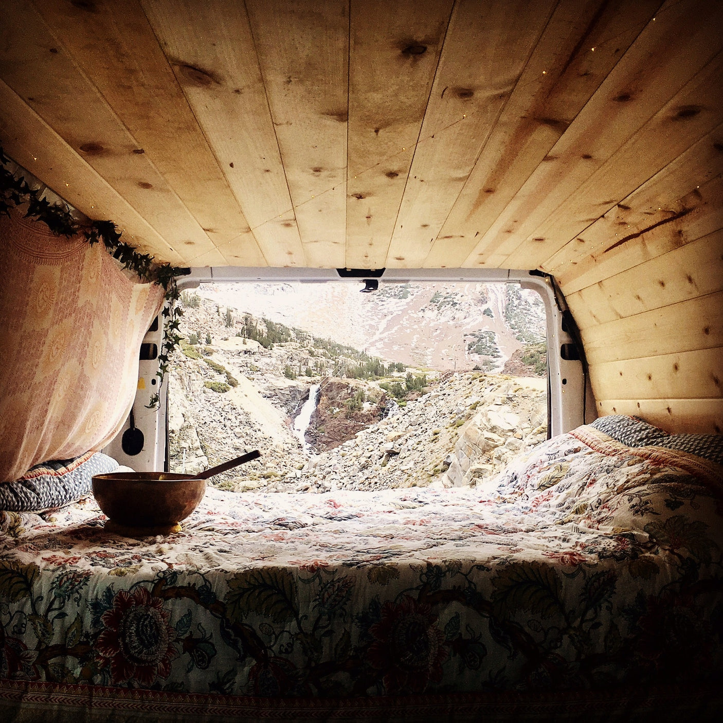 Cozy RV rental bed with a bowl
