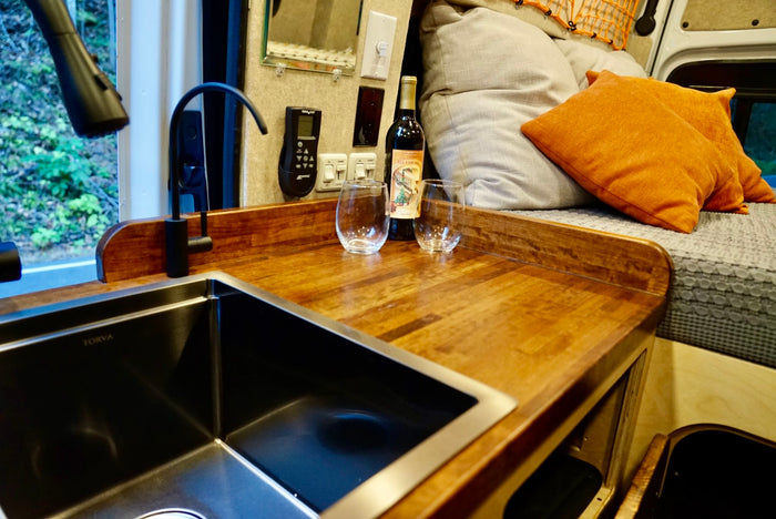 and shower. Perfect for RV rental.|Inside this RV rental: a cozy bed