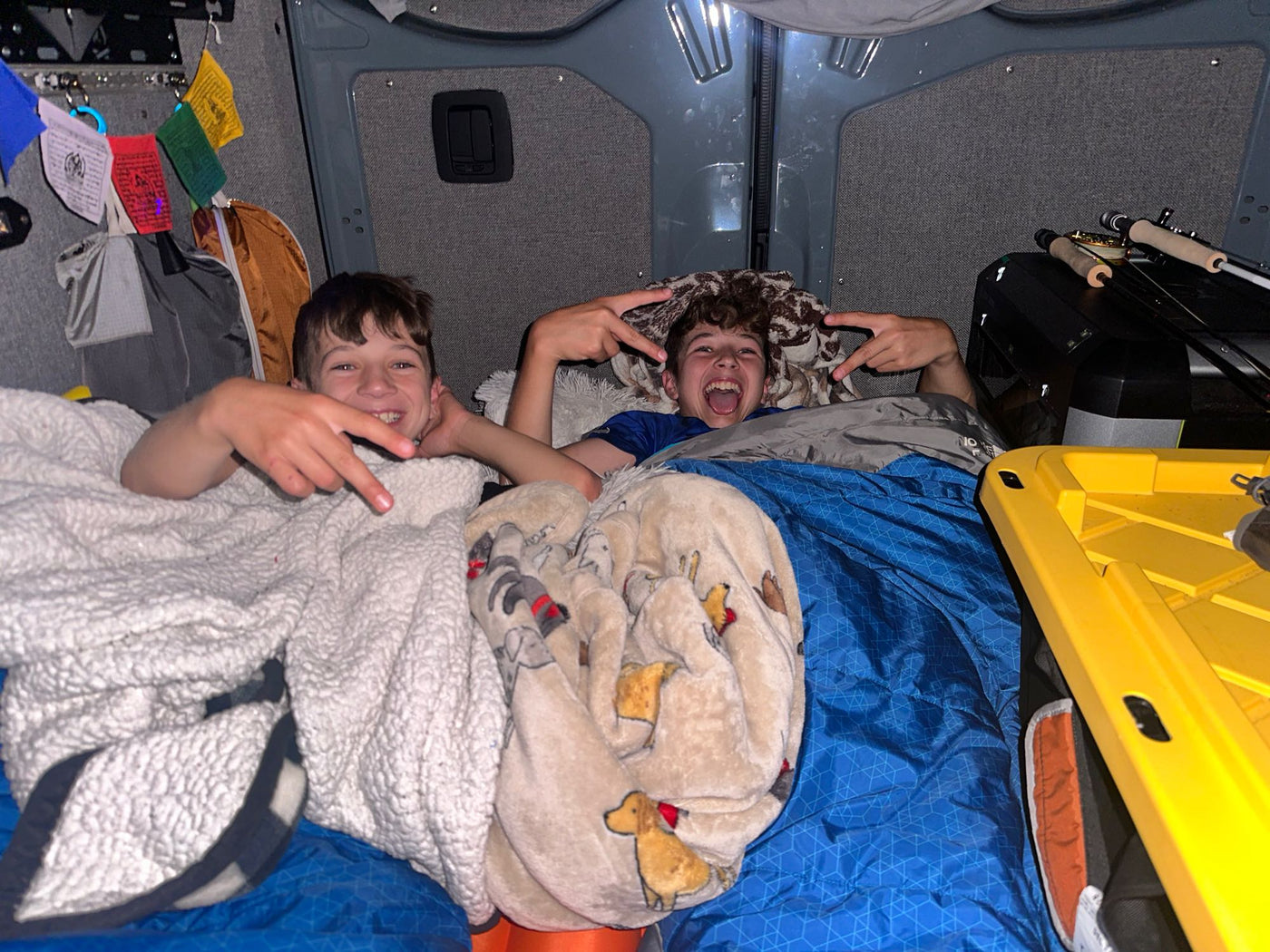 and custom interior for road trip adventures.|View inside an RV rental showing organized overhead storage — photo 15
