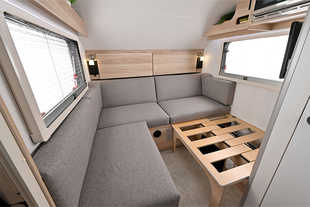 and essentials for comfortable travel.|Overhead view of an RV rental interior