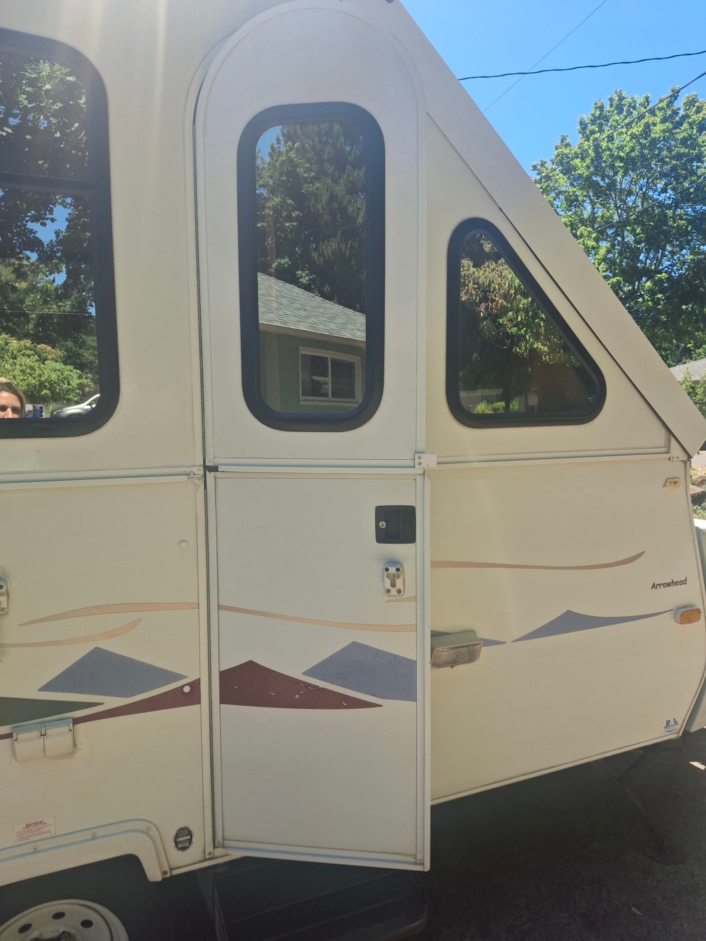 and a large skylight.|RV rental interior features a cozy bed/dinette