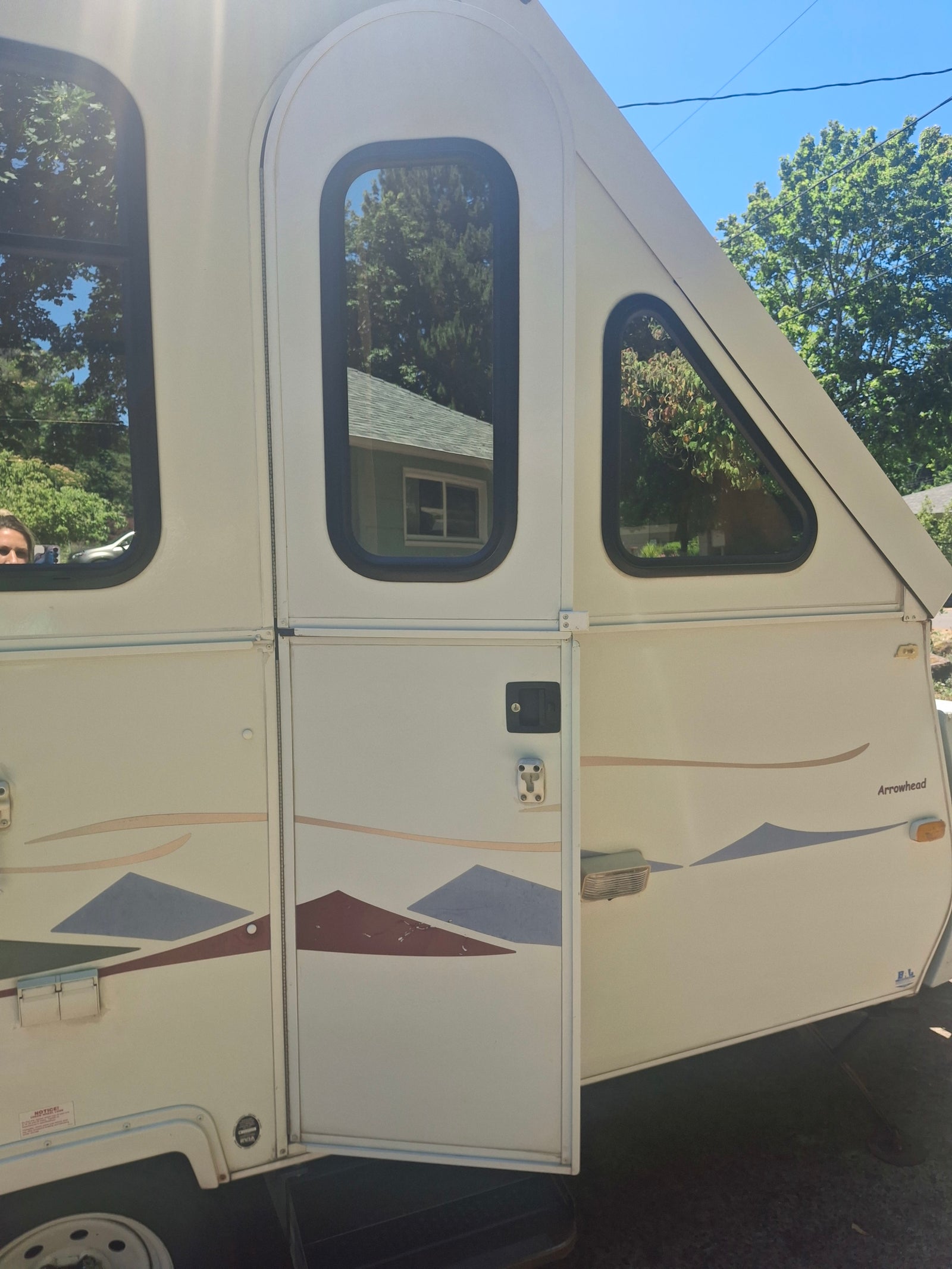 and a large skylight.|RV rental interior features a cozy bed/dinette
