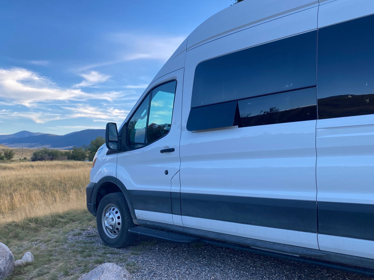 and overhead storage.|RV rental interior: cozy bed with blue ombré comforter — photo 9