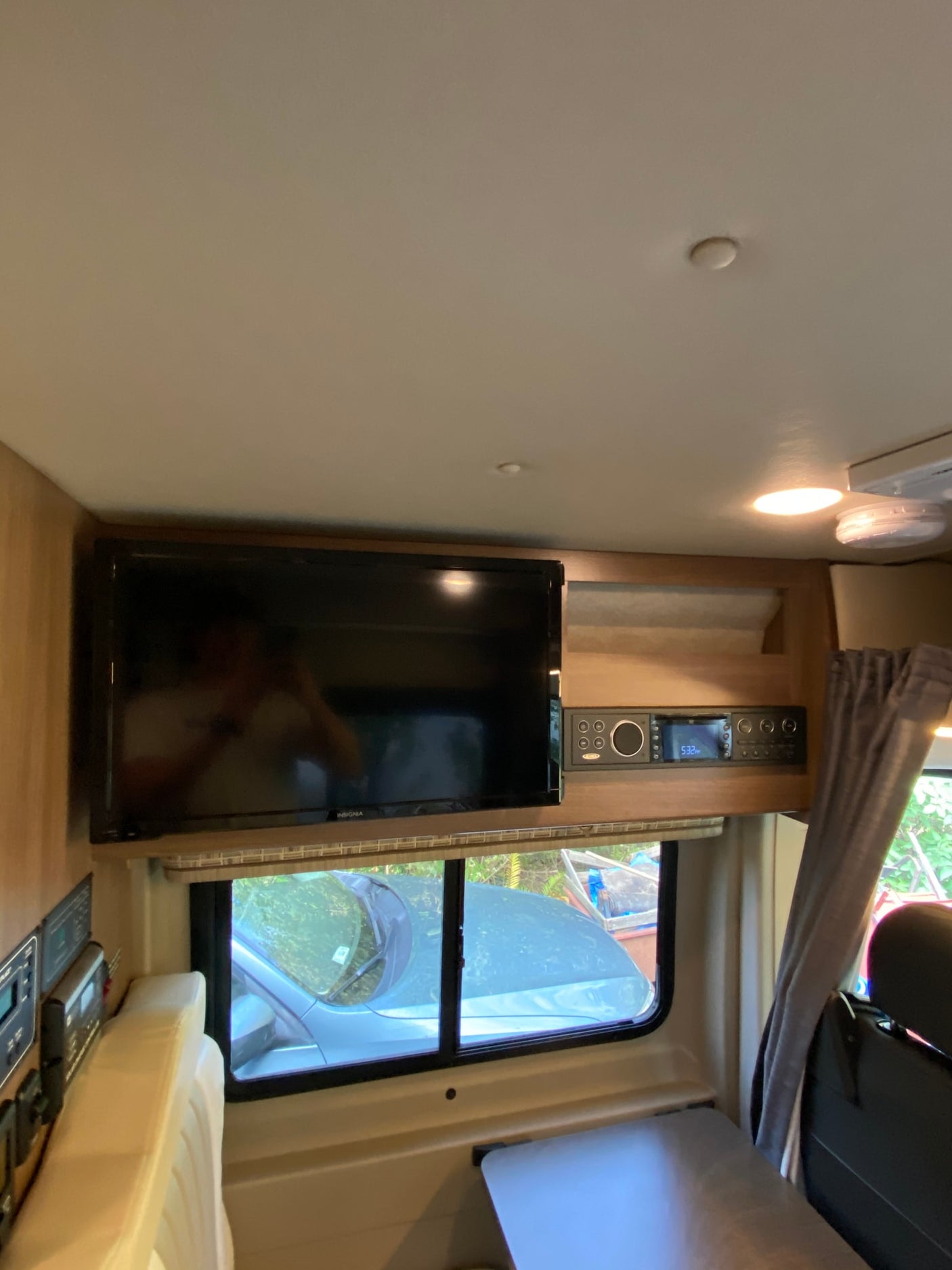 and integrated shower head for efficient use of space.|RV rental interior features a spacious bed with quilted mattress