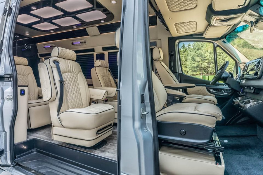 Luxurious rv rental interior with cream leather captain's chairs