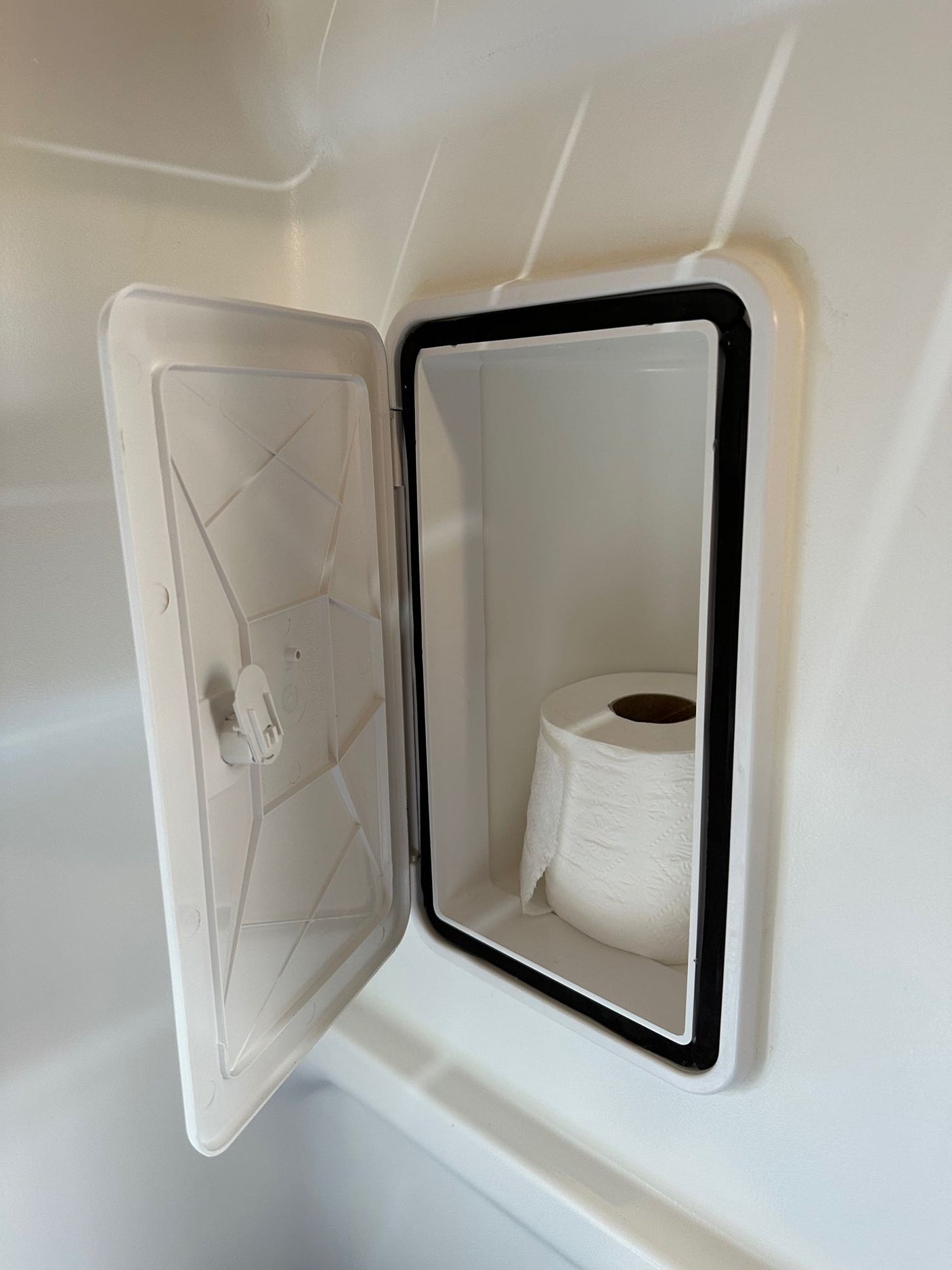 This RV rental features clever built-in toilet paper storage, keeping a roll neatly tucked away.