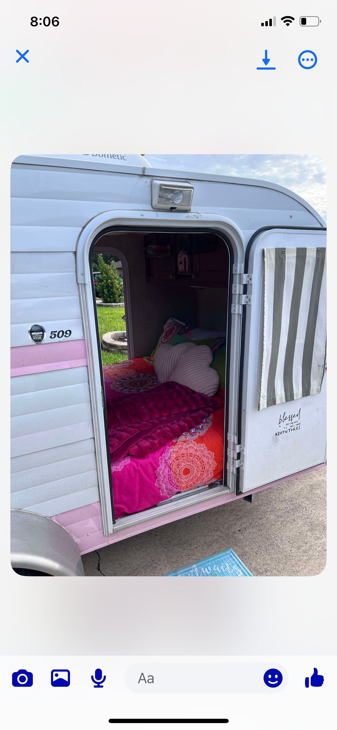 Cozy and colorful rv rental: A charming pink & white camper with a vibrant interior, ready for adventure.