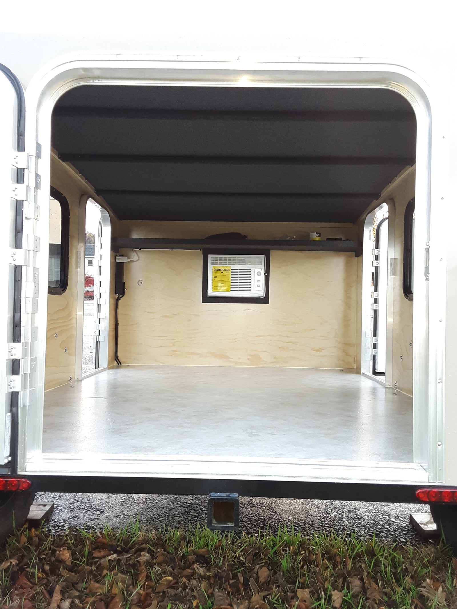 and seating. A small control panel is visible.|RV rental interior showing wall-mounted air conditioner