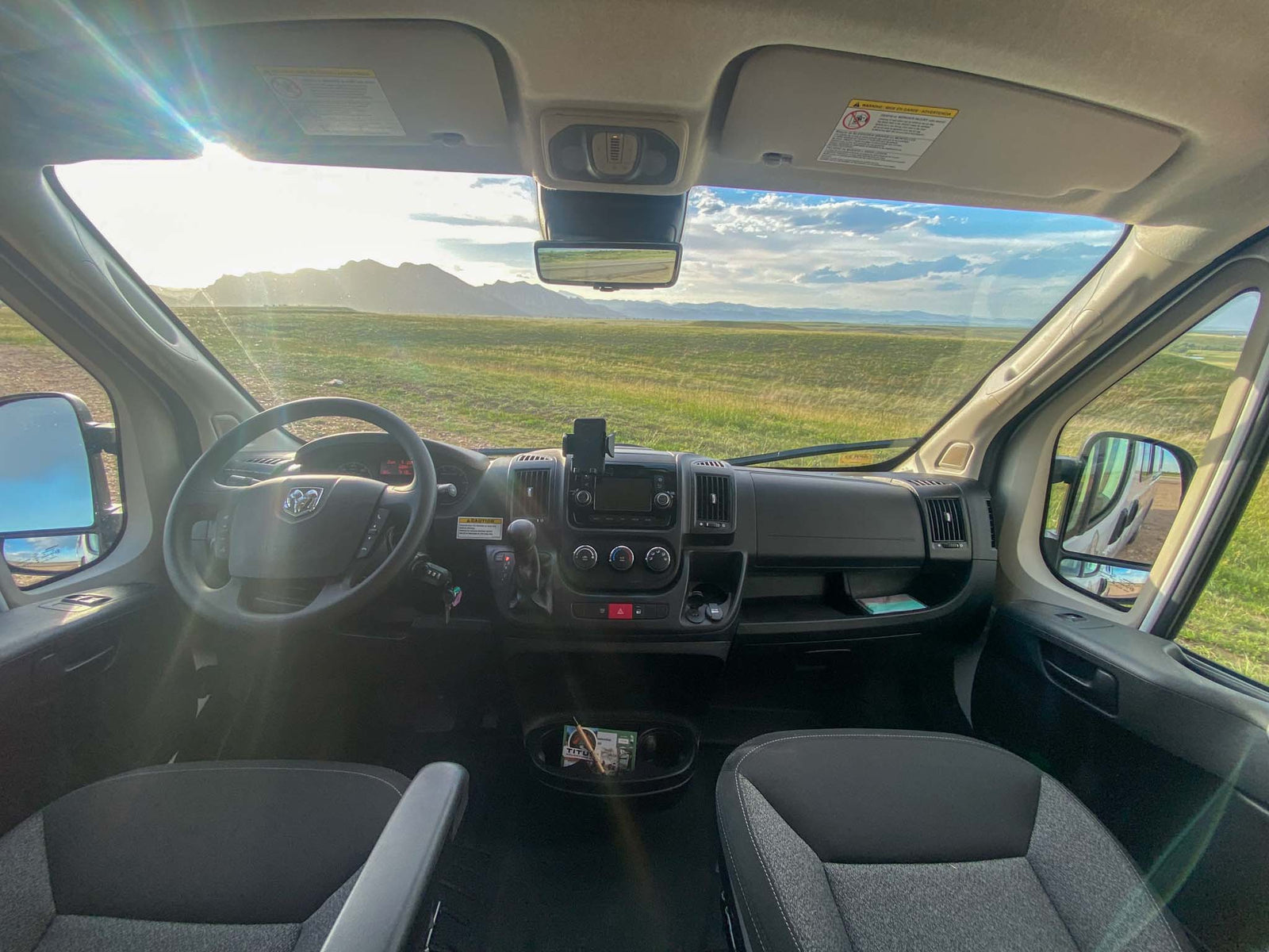 and cream passenger seats.|RV rental control panel: Truma heater