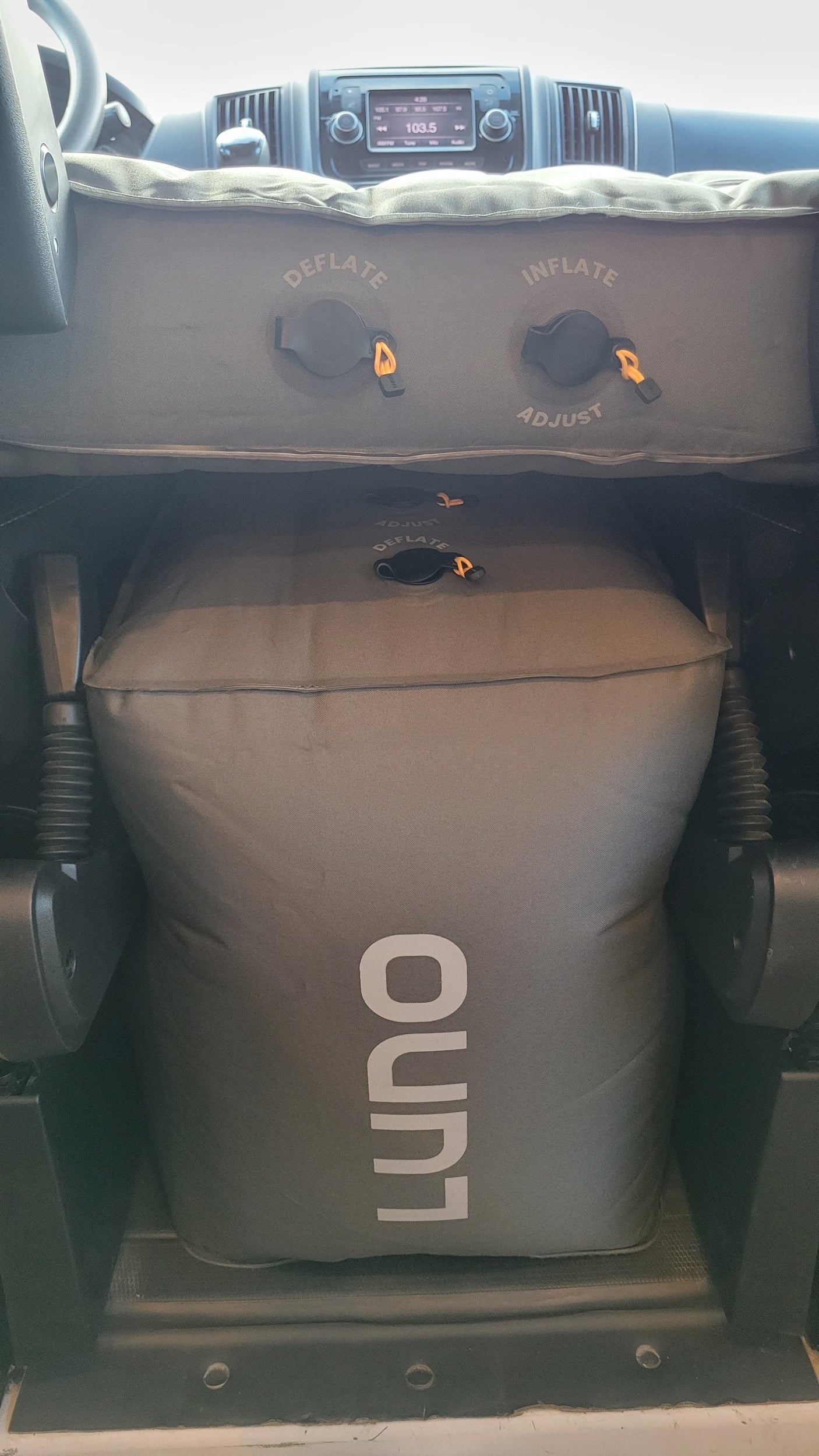 Luno air mattress setup in an RV rental, creating a comfortable bed with visible inflate/deflate controls.
