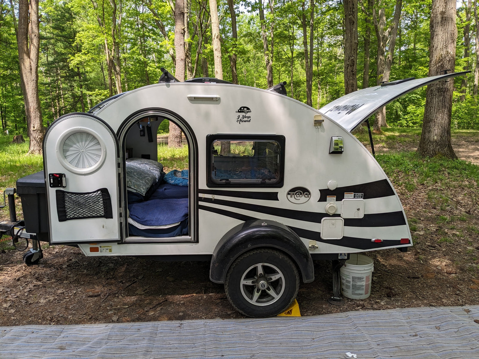 and hanging cooking utensils for your journey.|Norcold portable fridge/freezer on a pull-out tray in an rv rental