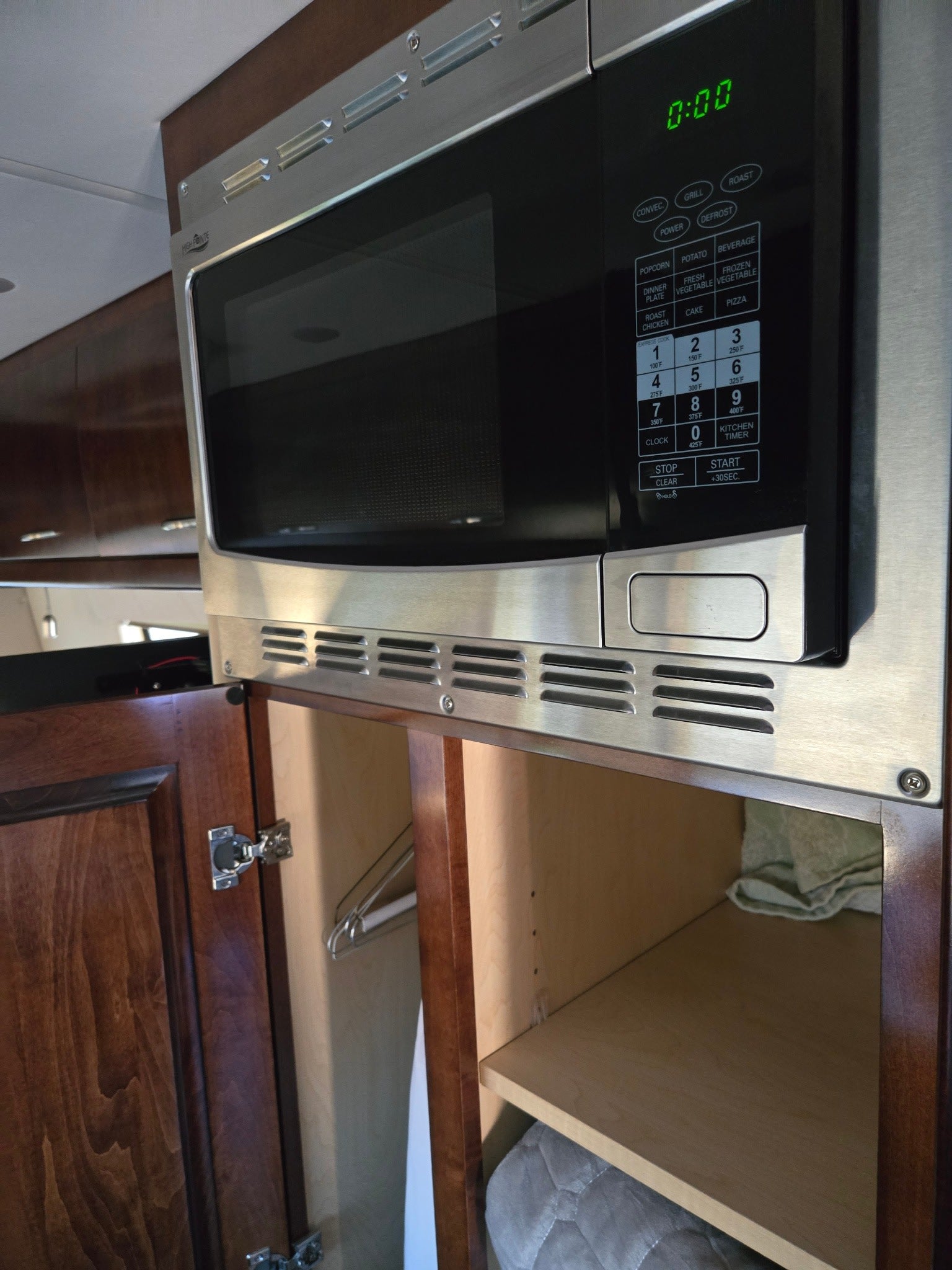 perfect for a camper van.|RV rental interior with a mounted TV