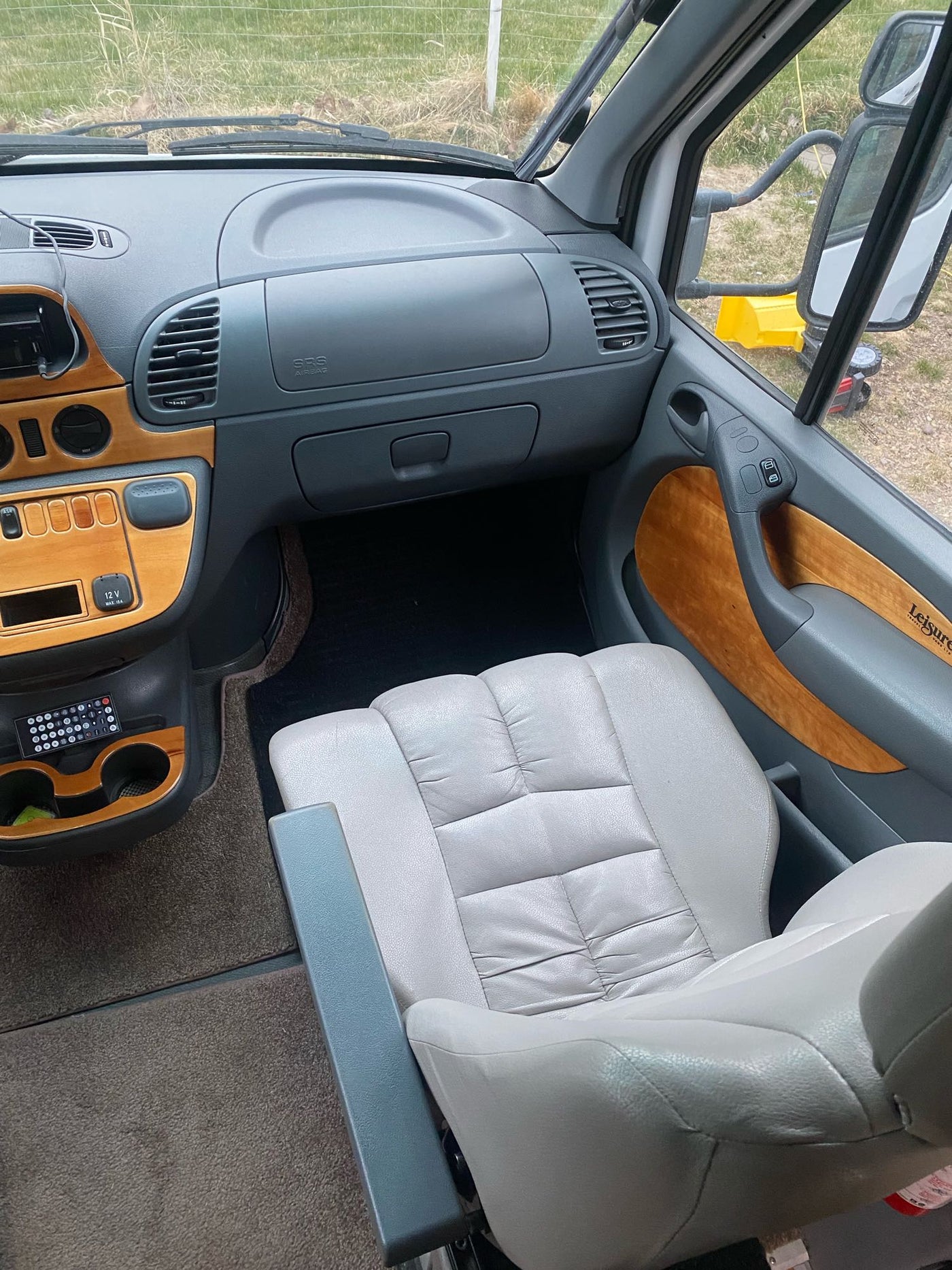 & cockpit. Great for travel.|RV rental interior: A cozy dinette setup with a plush sofa — photo 7