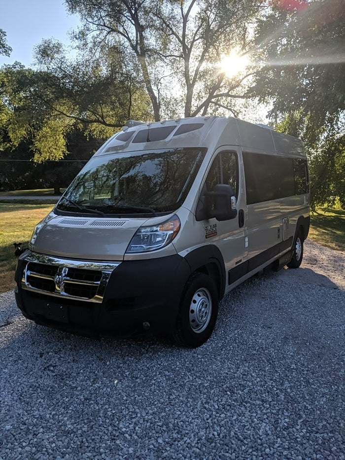 light-colored Ram ProMaster camper van