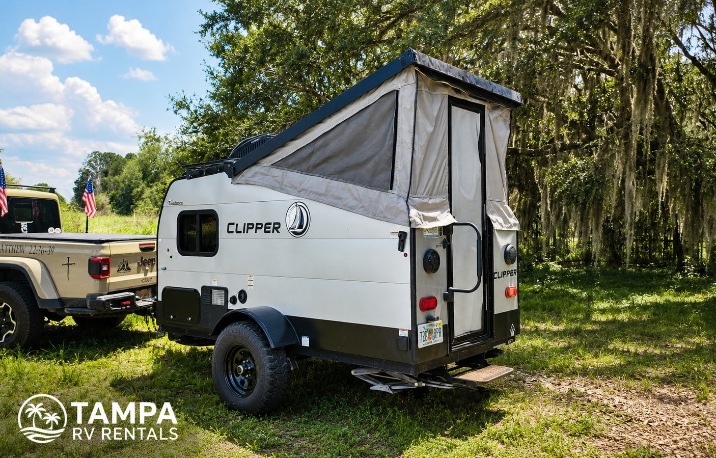 This RV rental features a pop-up camper towed by a Jeep Gladiator, parked in a sunny, grassy outdoor setting with trees. Perfect for camping.