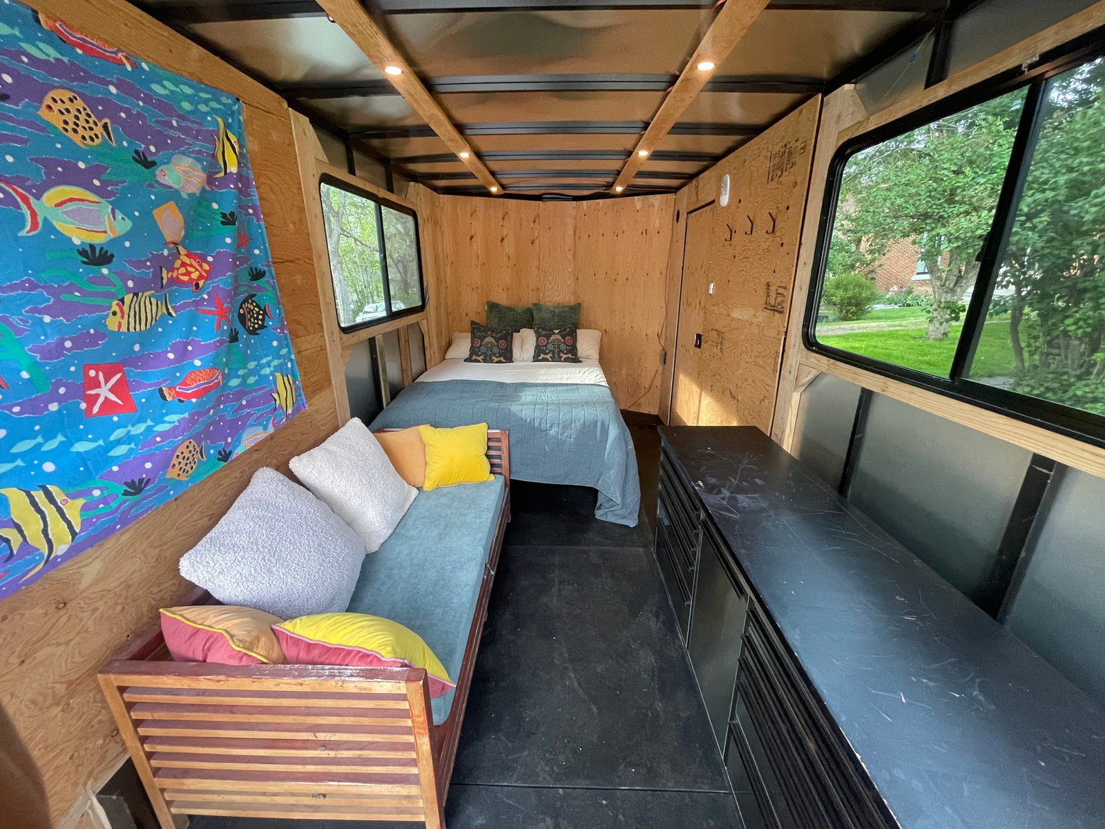 Cozy rv rental camper interior featuring a bed