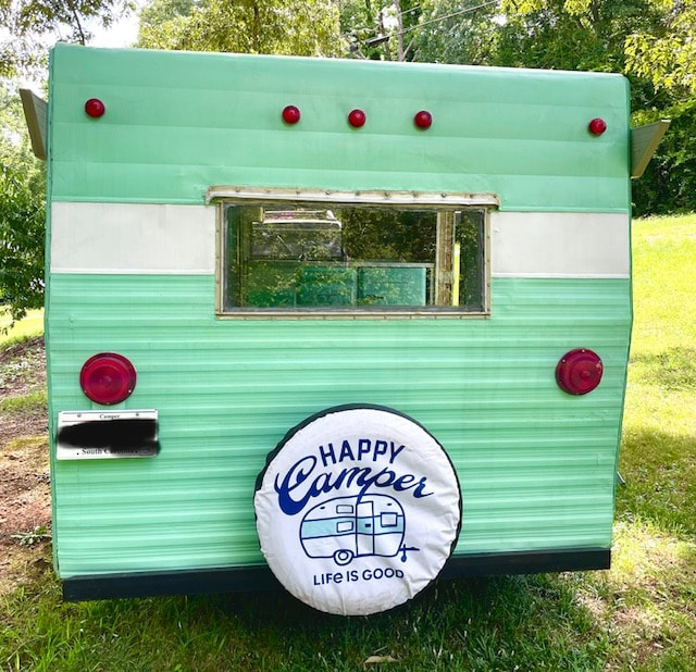 and cheerful checked curtains.|Retro green & white RV camper