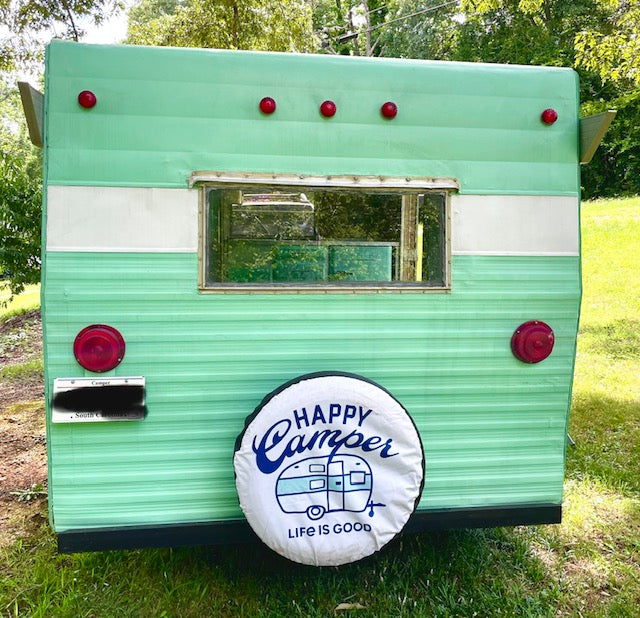 and cheerful checked curtains.|Retro green & white RV camper